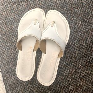 Kenos white leather sandals.